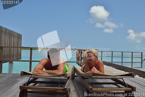 Image of happy young  couple at summer vacation have fun and relax at bea