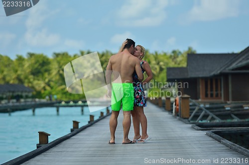 Image of happy young  couple at summer vacation have fun and relax at bea