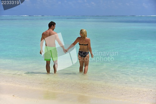Image of happy young  couple at summer vacation have fun and relax at bea