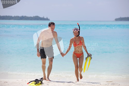 Image of happy young couple have fun on beach