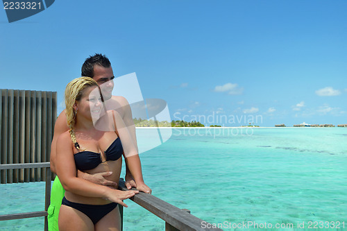 Image of happy young  couple at summer vacation have fun and relax at bea