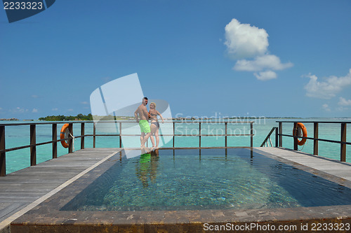 Image of happy young  couple at summer vacation have fun and relax at bea