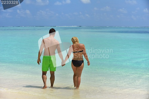 Image of happy young  couple at summer vacation have fun and relax at bea