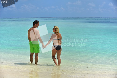 Image of happy young  couple at summer vacation have fun and relax at bea