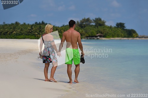 Image of happy young  couple at summer vacation have fun and relax at bea