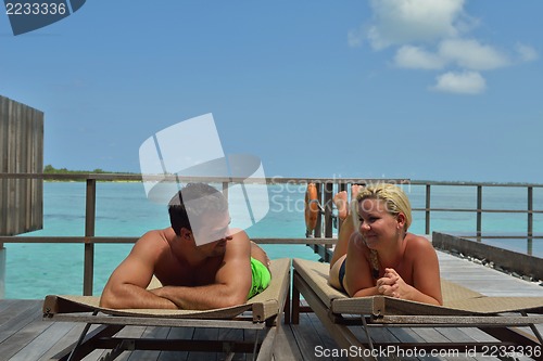 Image of happy young  couple at summer vacation have fun and relax at bea