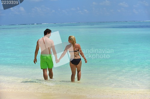 Image of happy young  couple at summer vacation have fun and relax at bea