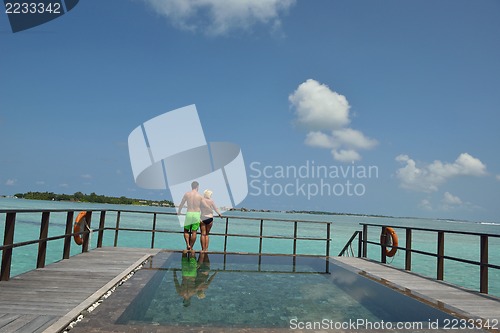 Image of happy young  couple at summer vacation have fun and relax at bea
