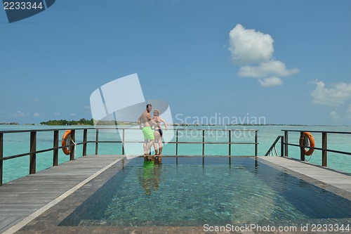 Image of happy young  couple at summer vacation have fun and relax at bea