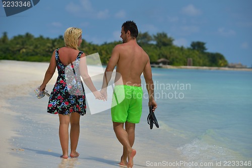 Image of happy young  couple at summer vacation have fun and relax at bea