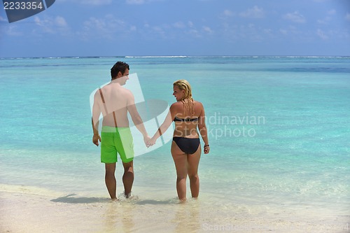 Image of happy young  couple at summer vacation have fun and relax at bea