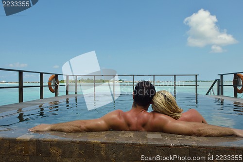 Image of happy young  couple at summer vacation have fun and relax at bea