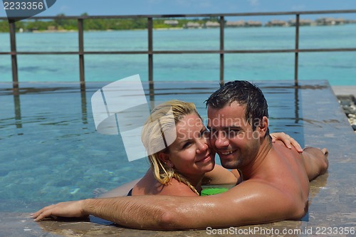 Image of happy young  couple at summer vacation have fun and relax at bea