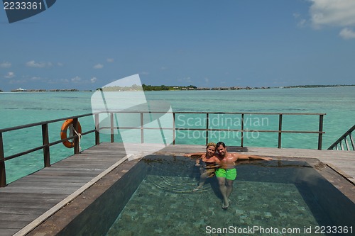 Image of happy young  couple at summer vacation have fun and relax at bea