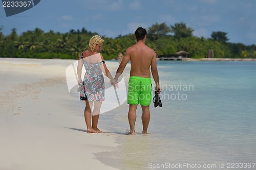 Image of happy young  couple at summer vacation have fun and relax at bea