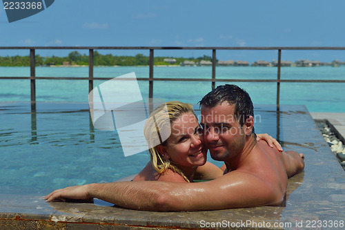 Image of happy young  couple at summer vacation have fun and relax at bea