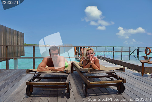 Image of happy young  couple at summer vacation have fun and relax at bea