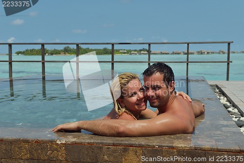 Image of happy young  couple at summer vacation have fun and relax at bea