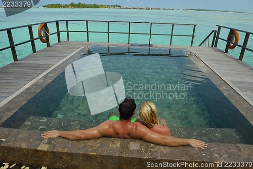 Image of happy young  couple at summer vacation have fun and relax at bea