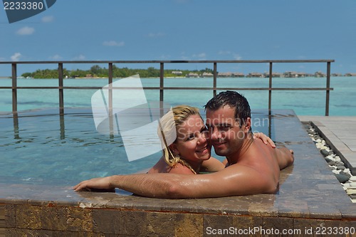Image of happy young  couple at summer vacation have fun and relax at bea