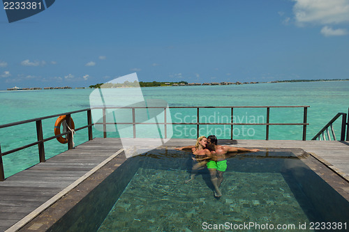 Image of happy young  couple at summer vacation have fun and relax at bea