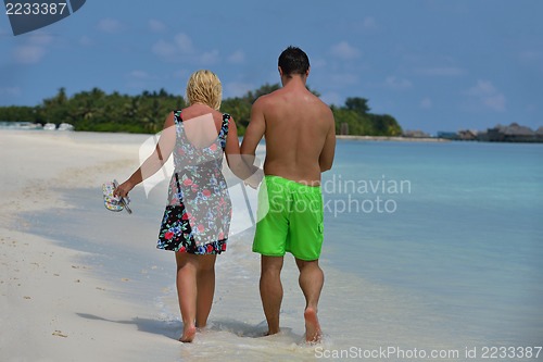 Image of happy young  couple at summer vacation have fun and relax at bea
