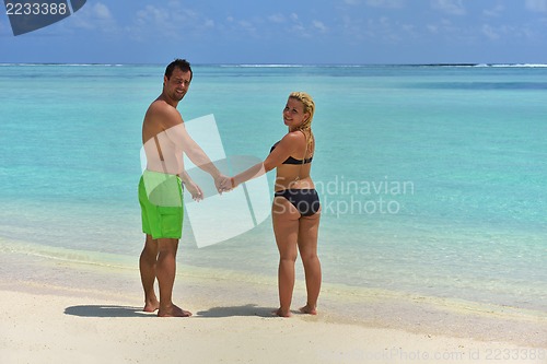 Image of happy young  couple at summer vacation have fun and relax at bea