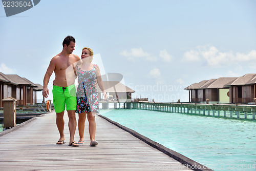 Image of happy young  couple at summer vacation have fun and relax at bea