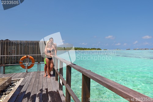 Image of happy young  couple at summer vacation have fun and relax at bea