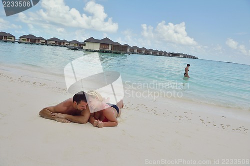 Image of happy young  couple at summer vacation have fun and relax at bea