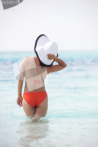 Image of beautiful gril on beach have fun