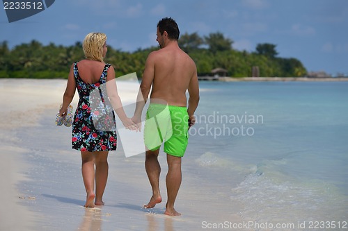 Image of happy young  couple at summer vacation have fun and relax at bea