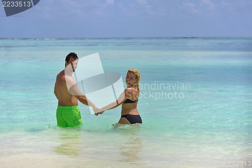 Image of happy young  couple at summer vacation have fun and relax at bea
