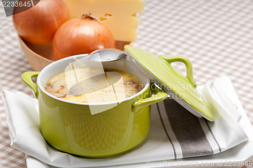 Image of onion soup with melted cheese and bread on top
