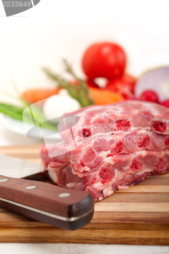 Image of chopping fresh pork ribs and vegetables