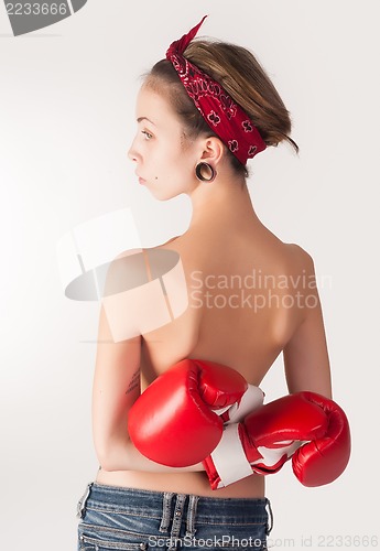 Image of beautiful topless woman with boxing gloves