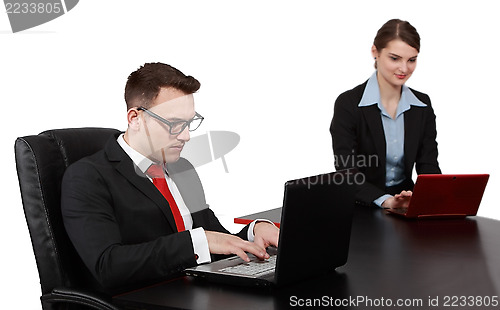 Image of Young Business Couple on Laptops