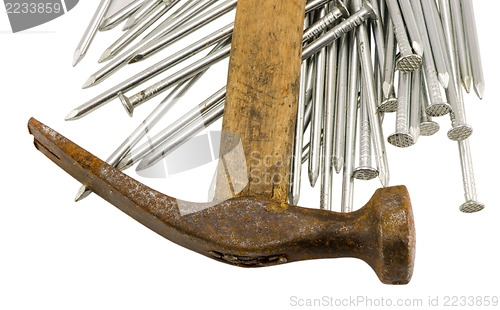 Image of curvy vintage rusty hammer nails pile isolated 