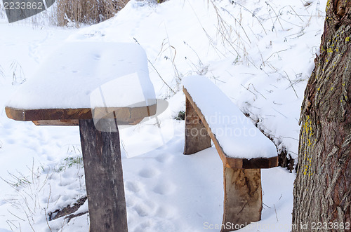 Image of old table bench deep snowbank surface cover snow  