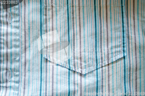 Image of shirt fabric pocket crumple blue lines background 