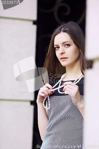 Image of Girl with beads