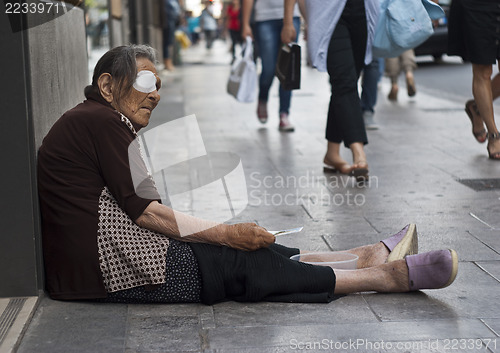 Image of homeless old woman beggar