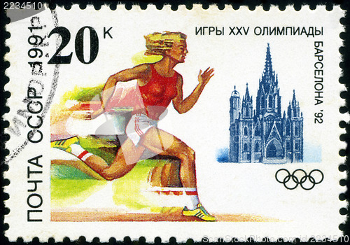 Image of USSR - CIRCA 1991: A stamp printed in USSR shows a woman athlete