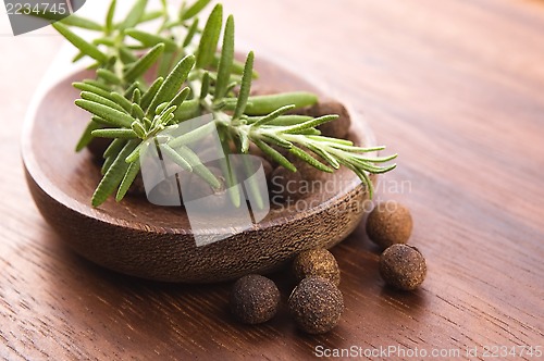 Image of allspice with fresh rosemary