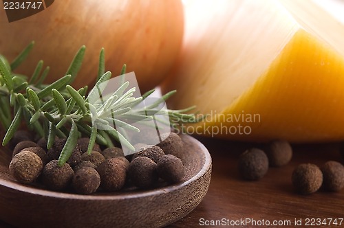 Image of allspice with fresh rosemary, cheese and onion