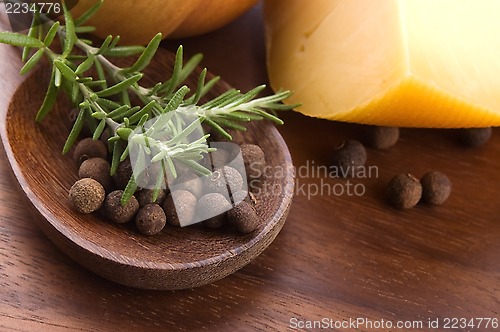 Image of allspice with fresh rosemary, cheese and onion