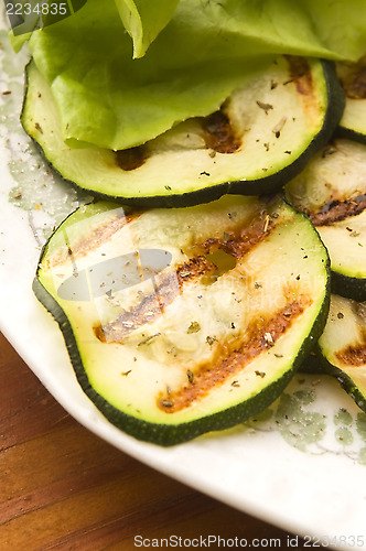 Image of Grilled organic zucchini slices with herbs and spices