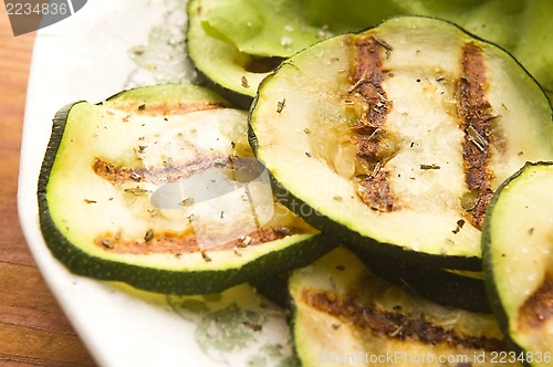 Image of Grilled organic zucchini slices with herbs and spices