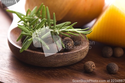 Image of allspice with fresh rosemary, cheese and onion