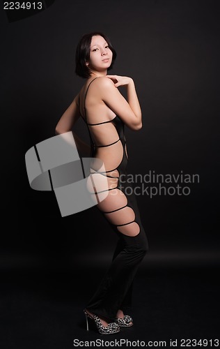 Image of Beautiful woman in sexy overalls